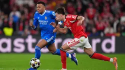 Kylian Mbappe of Real Madrid battles for possession with Amar Dedic of Benfica.