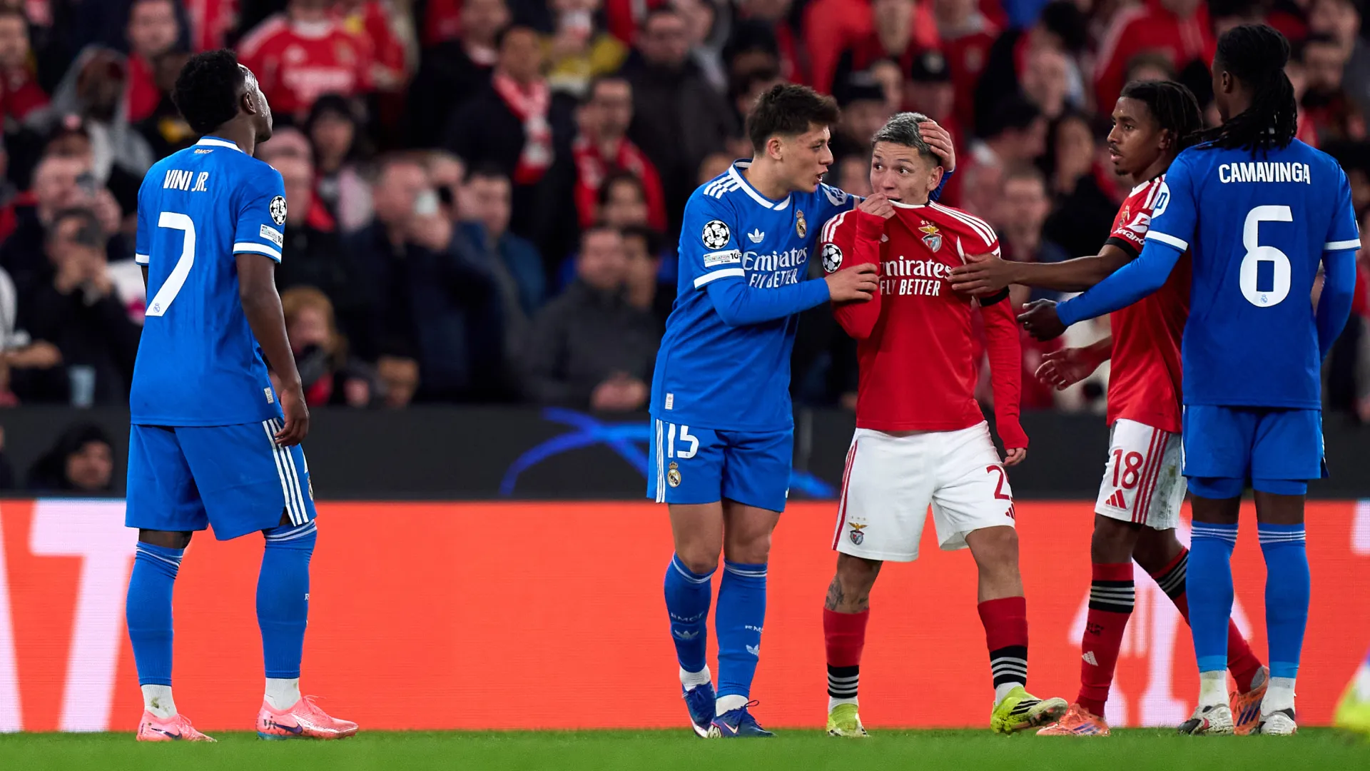 Gianluca Prestianni of Benfica speaks covering his mouth towards Vinicius Junior. (Getty Images)