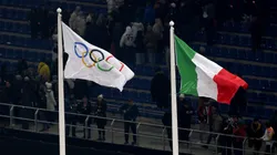 The Olympic flag is seen alongside the Italian flag during the opening ceremony of the Milano Cortina 2026 Winter Olympics.