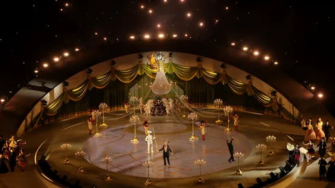 A general view of an illuminated chandelier as performers dance during the Milano Cortina 2026 Winter Olympics Closing Ceremony.