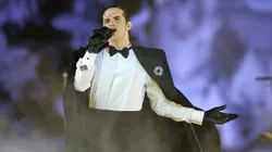 Achille Lauro and his band perform during the Milano Cortina 2026 Winter Olympics Closing Ceremony