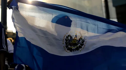 An El Salvador fan waves a flag