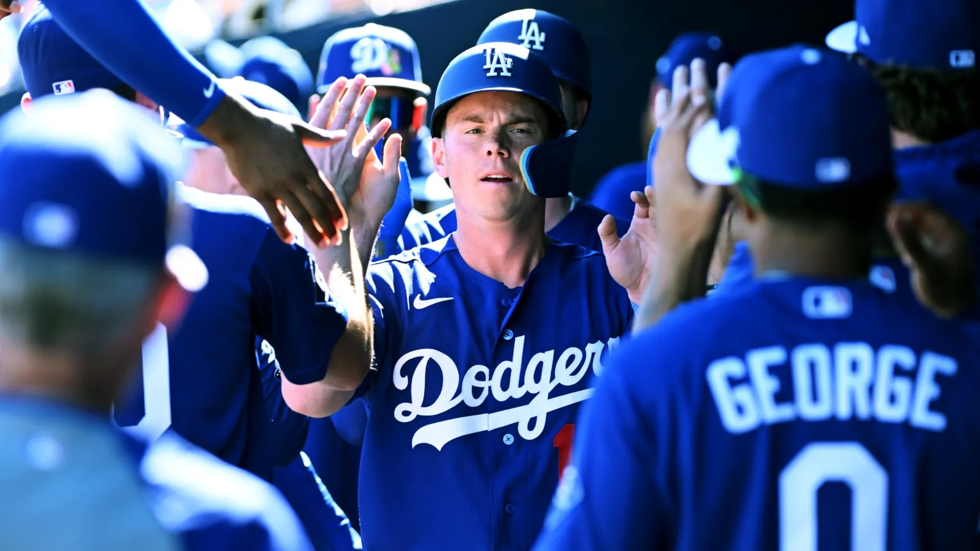 Will Smith of the Dodgers celebrates with teammates after scoring on a double hit spring training game (Source: Norm Hall/Getty Images)
