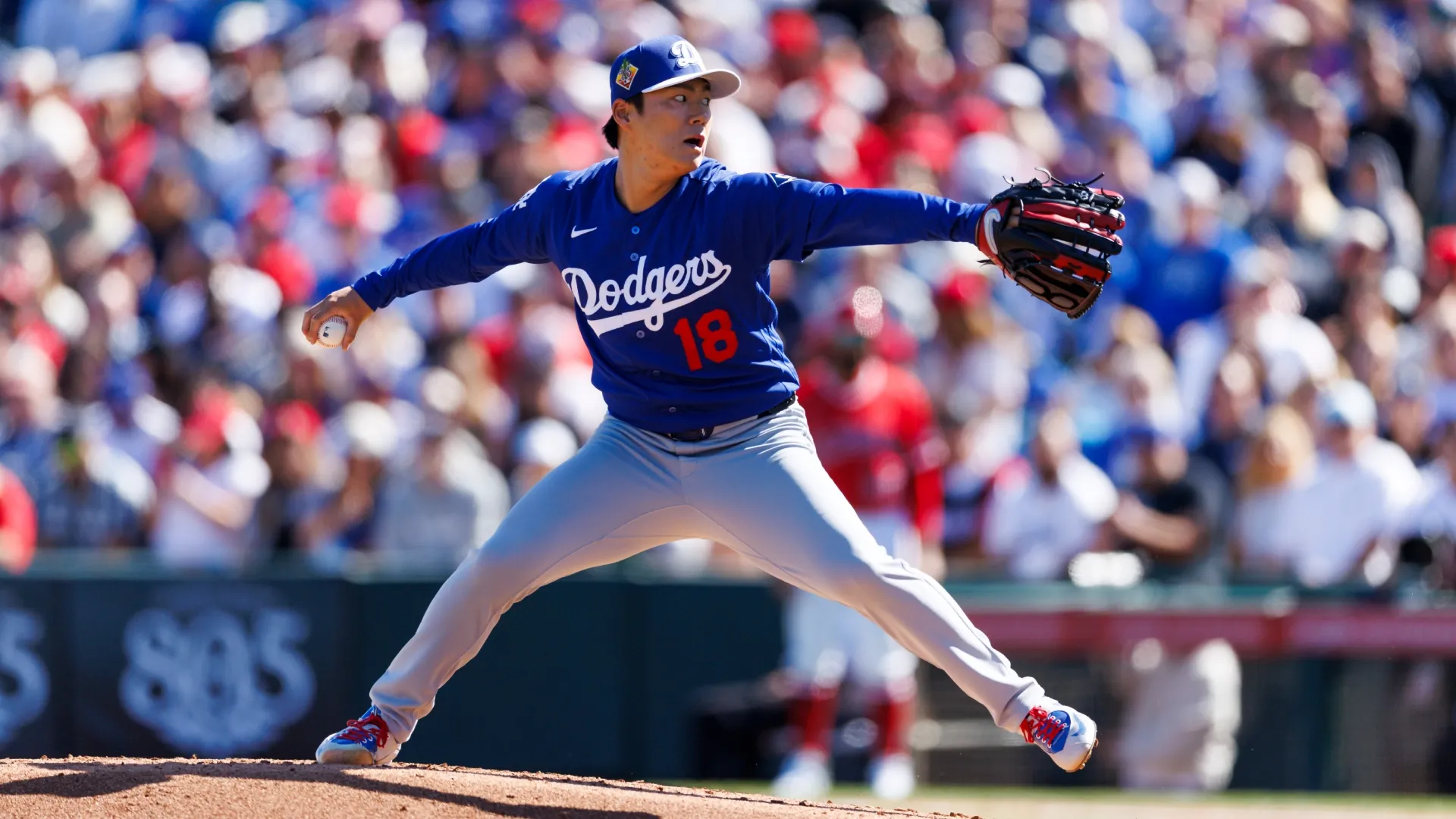 Yoshinobu Yamamoto #18 of the Dodgers pitches during the spring training game. Tapia/Getty Images