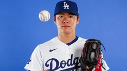 Yoshinobu Yamamoto #18 of the Los Angeles Dodgers poses for a photo.