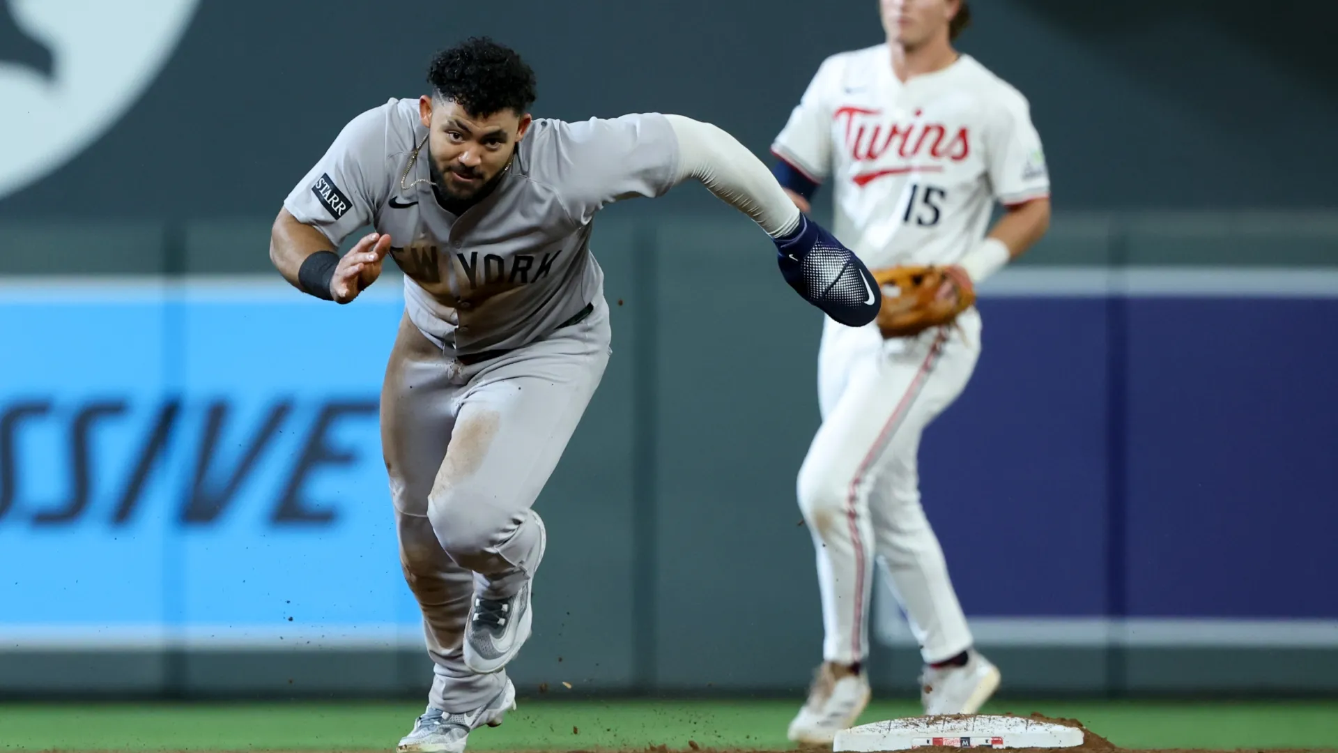 Jasson Domínguez #24 of the Yankees advances to third base on a throwing error on his stolen base. Ellen Schmidt/Getty Images
