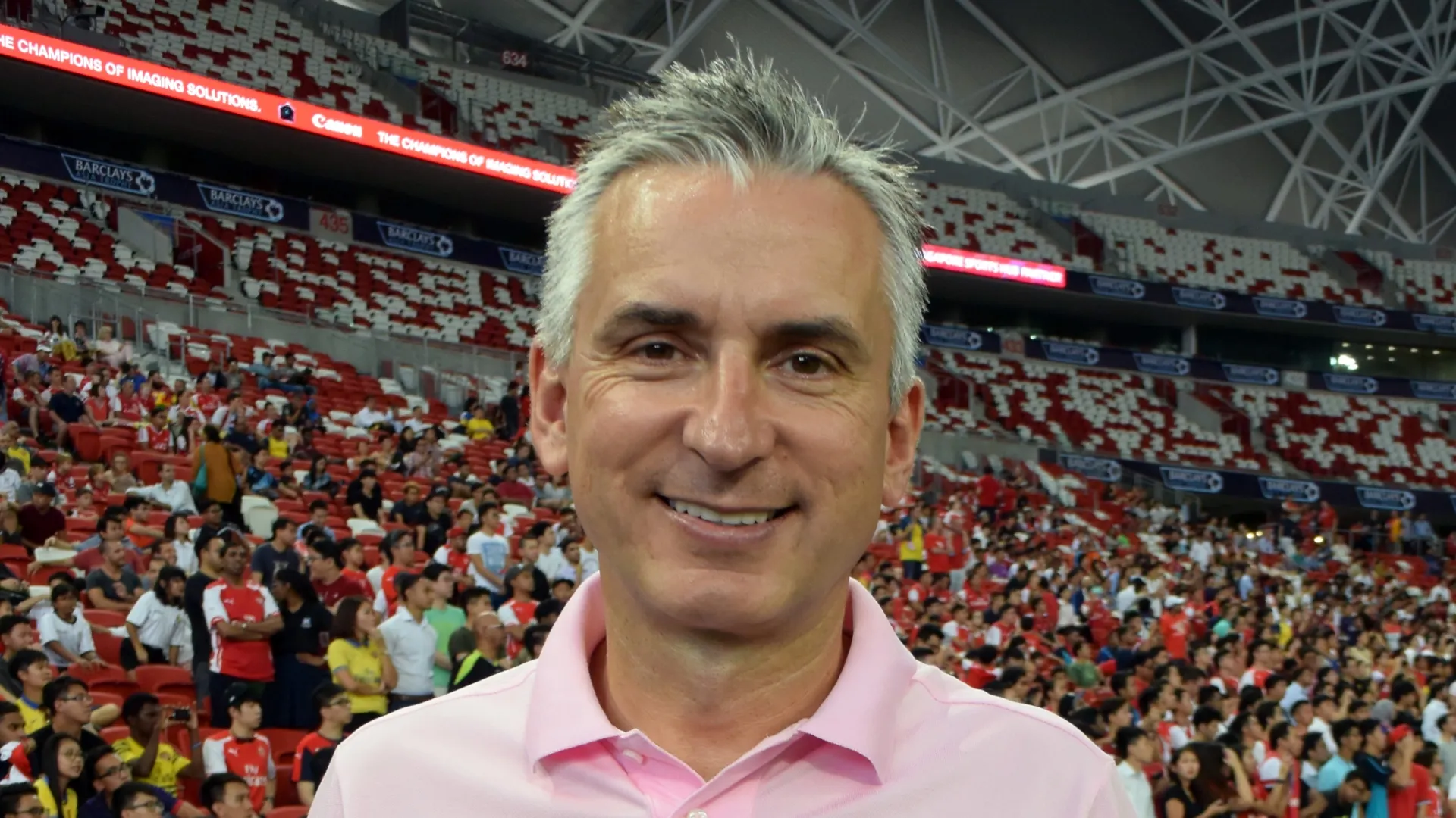 Arsenal legend Alan Smith poses during an Arsenal open training session in Singapore.