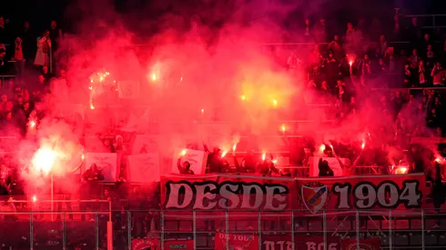 Fans of SL Benfica set off smoke flares at Estadi Olímpic Lluís Companys