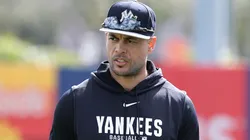 Giancarlo Stanton #27 of the Yankees warms up during team workouts.
