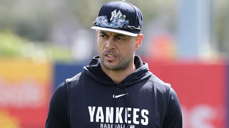 Giancarlo Stanton #27 of the Yankees warms up during team workouts.