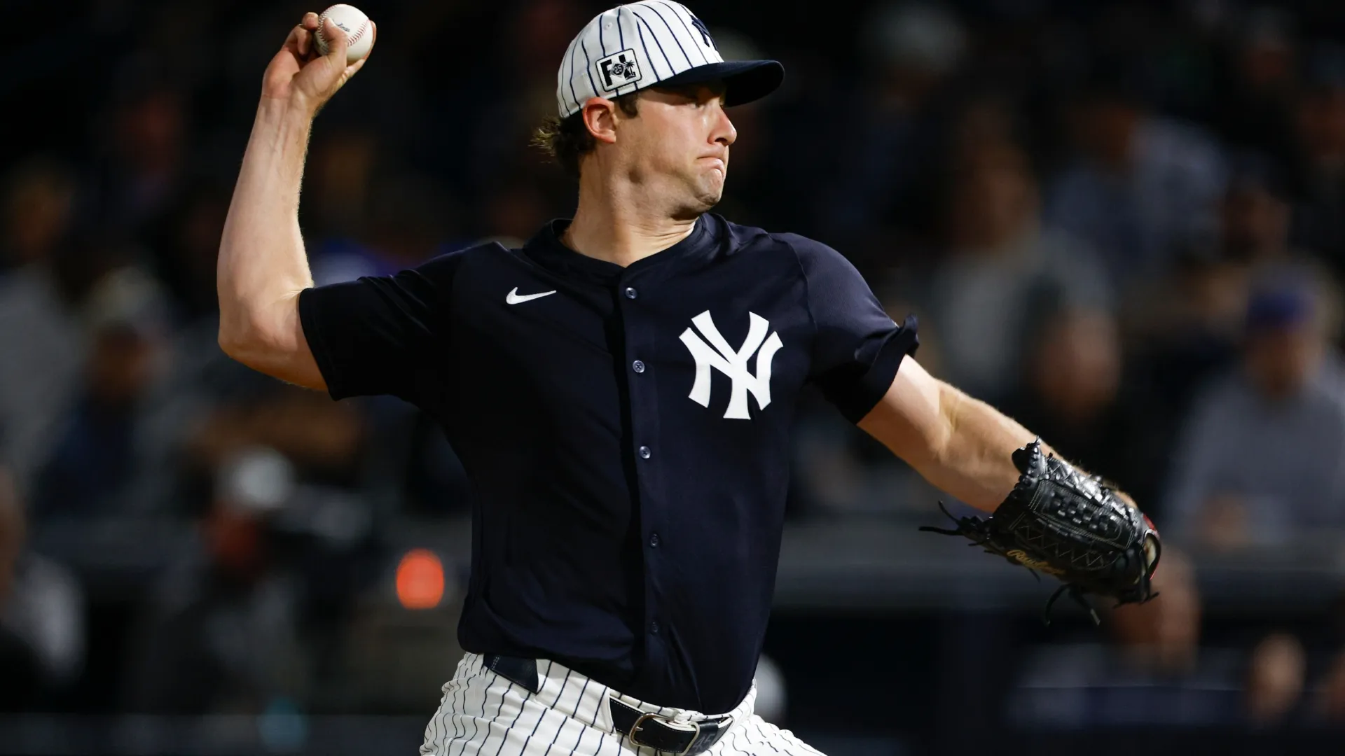 Gerrit Cole #45 of the Yankees throws a pitch during a spring training game. Brandon Sloter/Getty Images