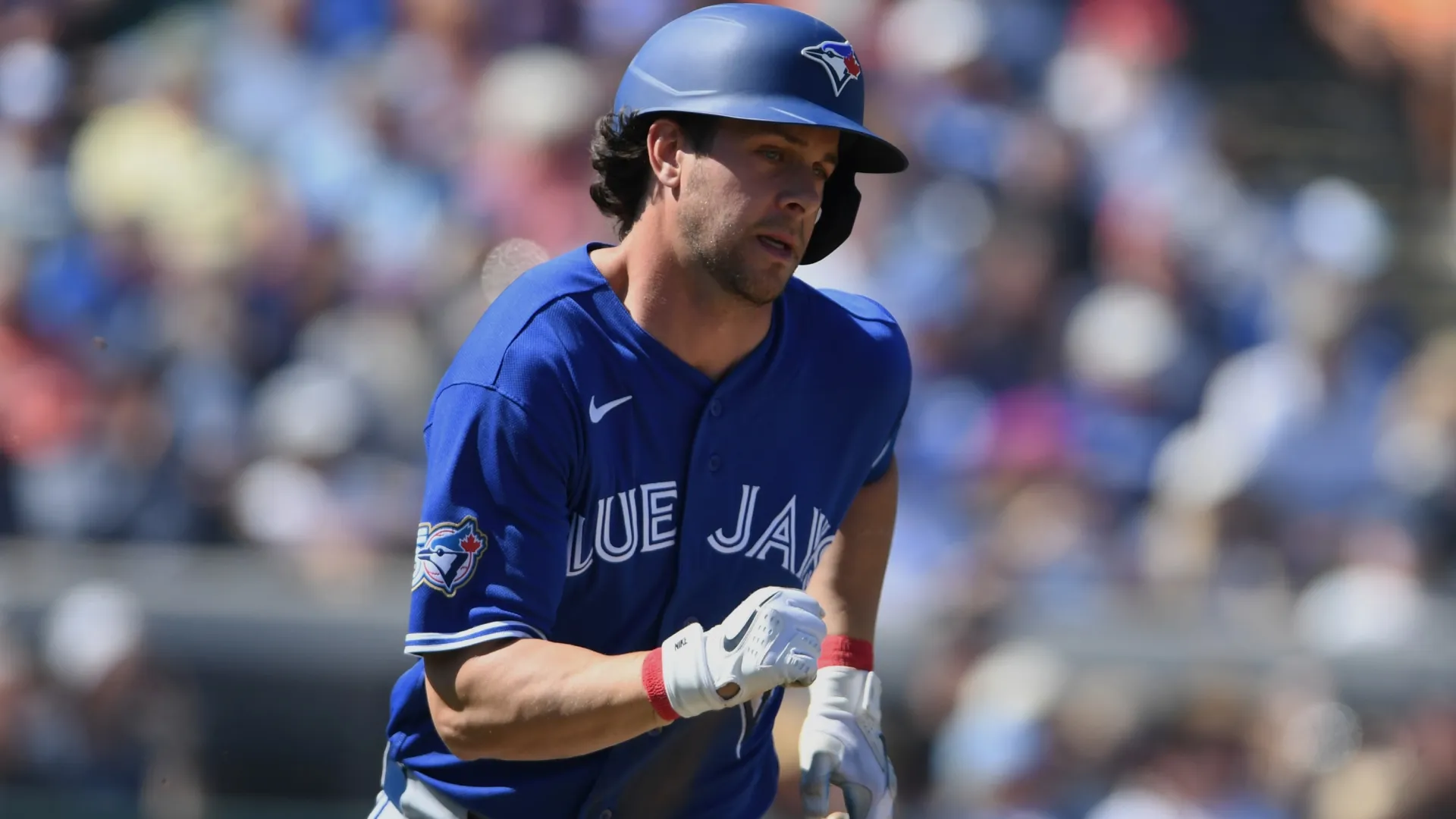 Ernie Clement of the Blue Jays hits a triple during a spring training game in 2026 (Source: Mark Taylor/Getty Images)