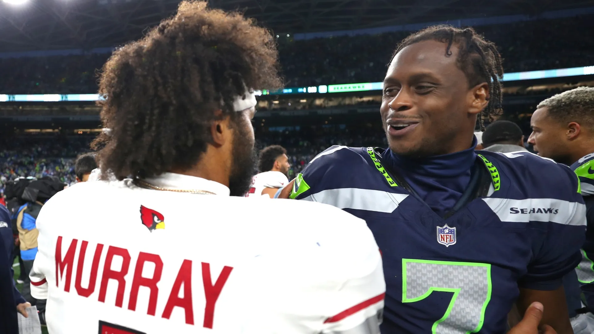 Kyler Murray #1 of the Arizona Cardinals congratulates Geno Smith #7 formerly of the Seattle Seahawks