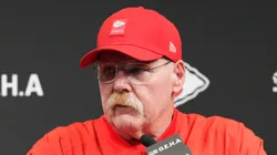 Andy Reid speaking at the podium.