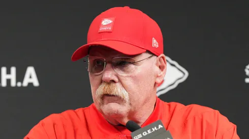 Andy Reid speaking at the podium.