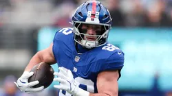 Daniel Bellinger #82 of the New York Giants scores a touchdown during a game in 2026.