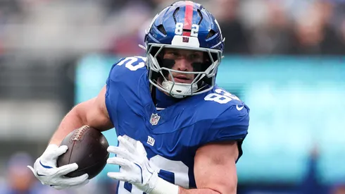 Daniel Bellinger #82 of the New York Giants scores a touchdown during a game in 2026.