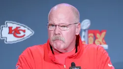 Andy Reid listens to a question at a press conference.