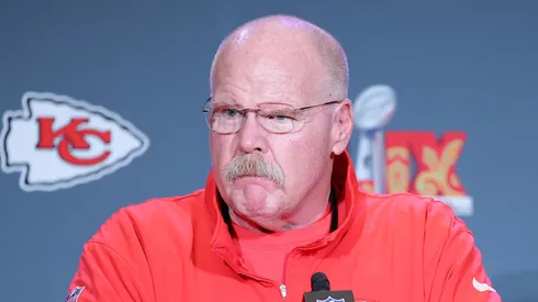 Andy Reid listens to a question at a press conference.