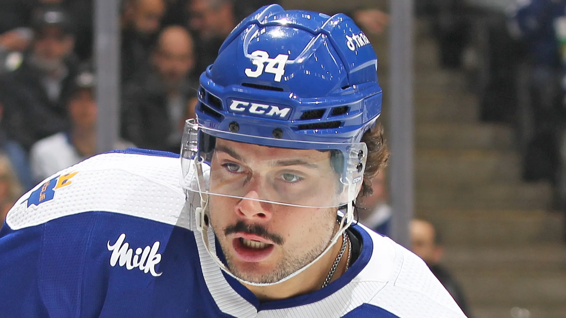 Auston Matthews stares at the puck