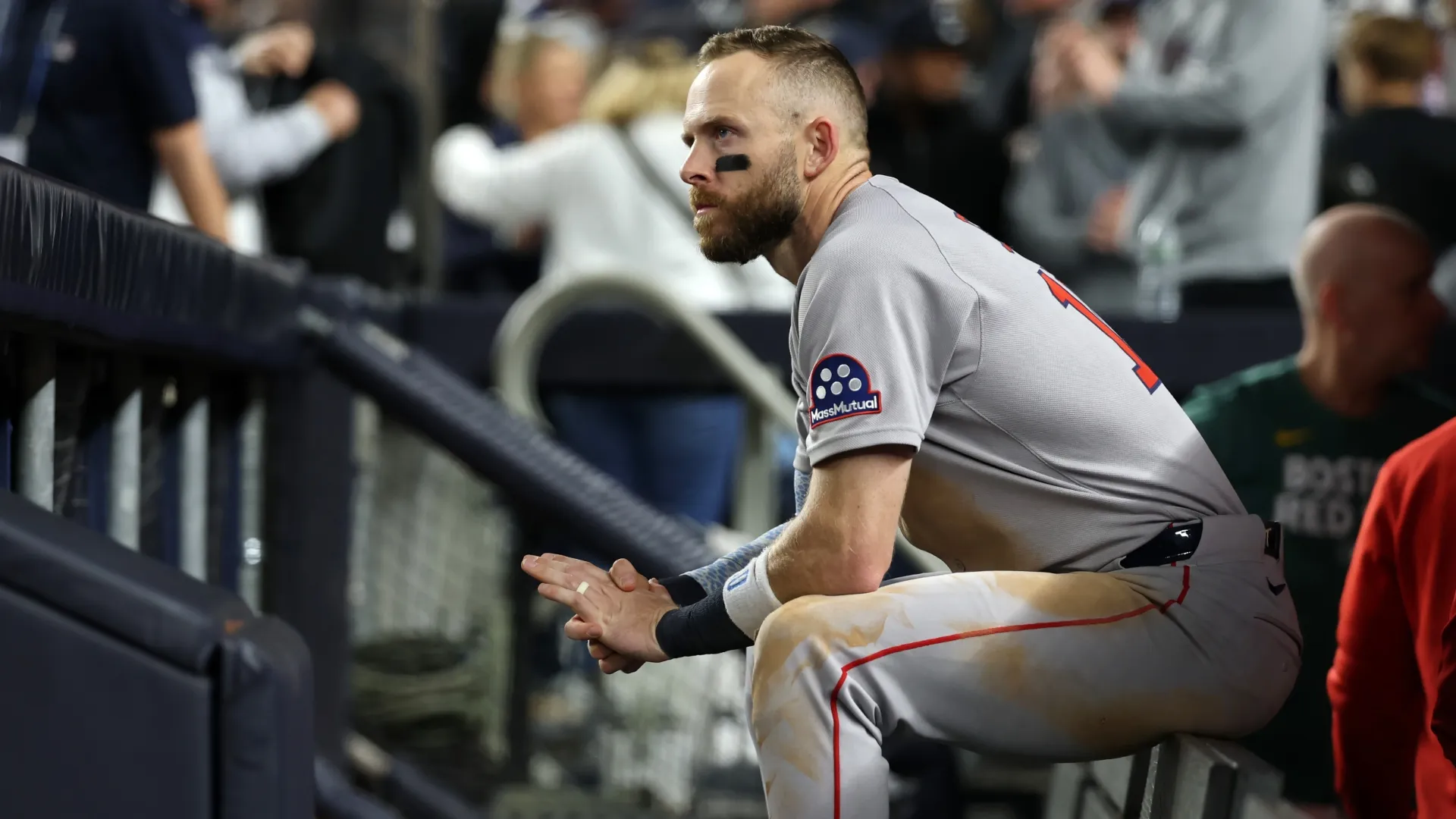 Trevor Story #10 of the Red Sox looks on from the dugout after losing to the Yankees. Al Bello/Getty Images)