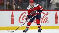 John Carlson #74 with the Capitals skates with the puck.