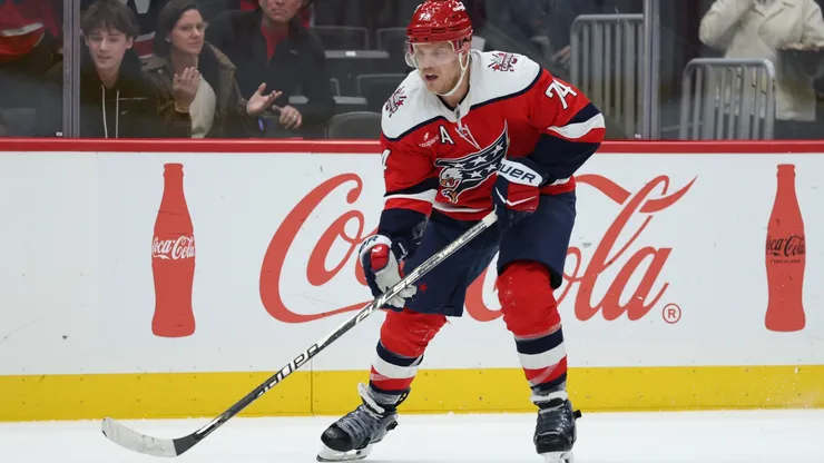 John Carlson #74 with the Capitals skates with the puck.