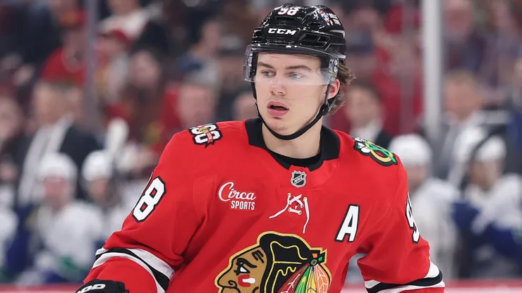 Connor Bedard #98 of the Blackhawks skates against the Canucks.