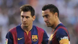Lionel Messi and Xavi Hernandez during a Barcelona match.
