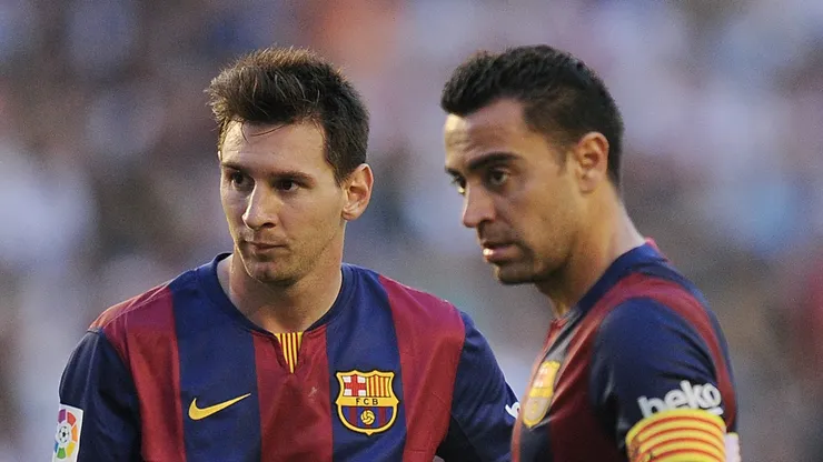 Lionel Messi and Xavi Hernandez during a Barcelona match.