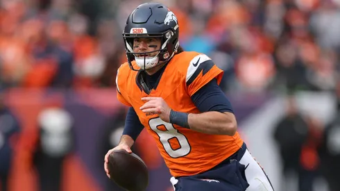 Jarrett Stidham #8 of the Denver Broncos rushes for yards in 2026.