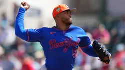 Freddy Peralta #51 of the Mets throws a pitch against the Cardinals.