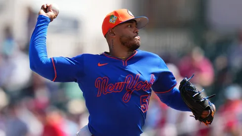 Freddy Peralta #51 of the Mets throws a pitch against the Cardinals.
