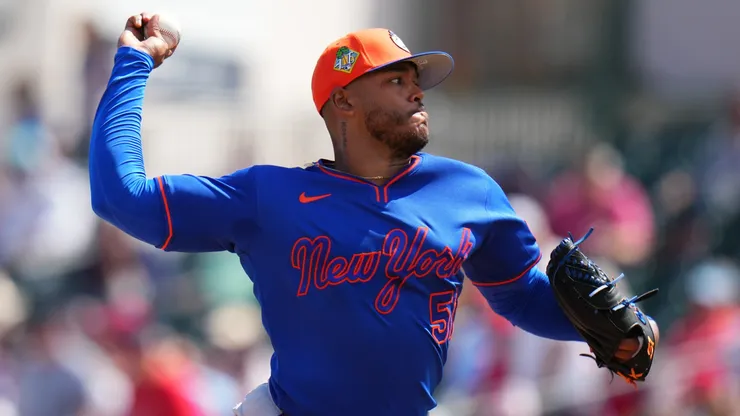 Freddy Peralta #51 of the Mets throws a pitch against the Cardinals.