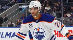 Darnell Nurse #25 of the Oilers skates against the Islanders.