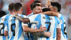 Lionel Messi of Argentina celebrates with teammates after scoring a goal.