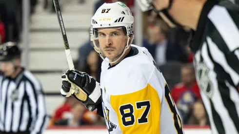 Sidney Crosby #87 of the Pittsburgh Penguins talks to referee Frederick L'Ecuyer in 2026.