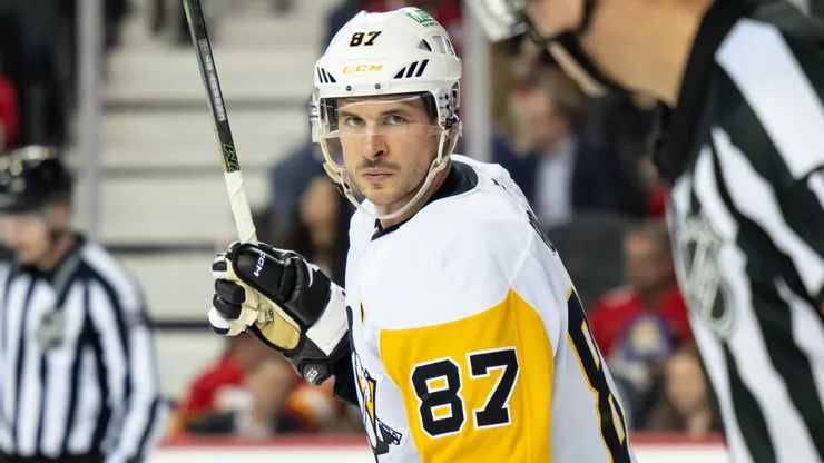 Sidney Crosby #87 of the Pittsburgh Penguins talks to referee Frederick L'Ecuyer in 2026.