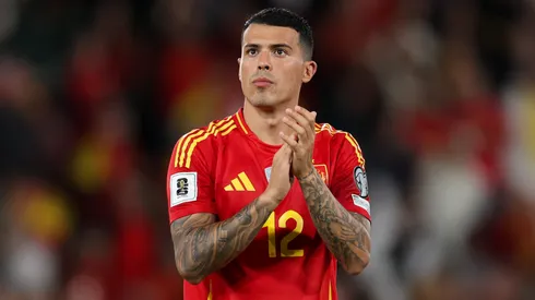 Pedro Porro of Spain applauds the fans.