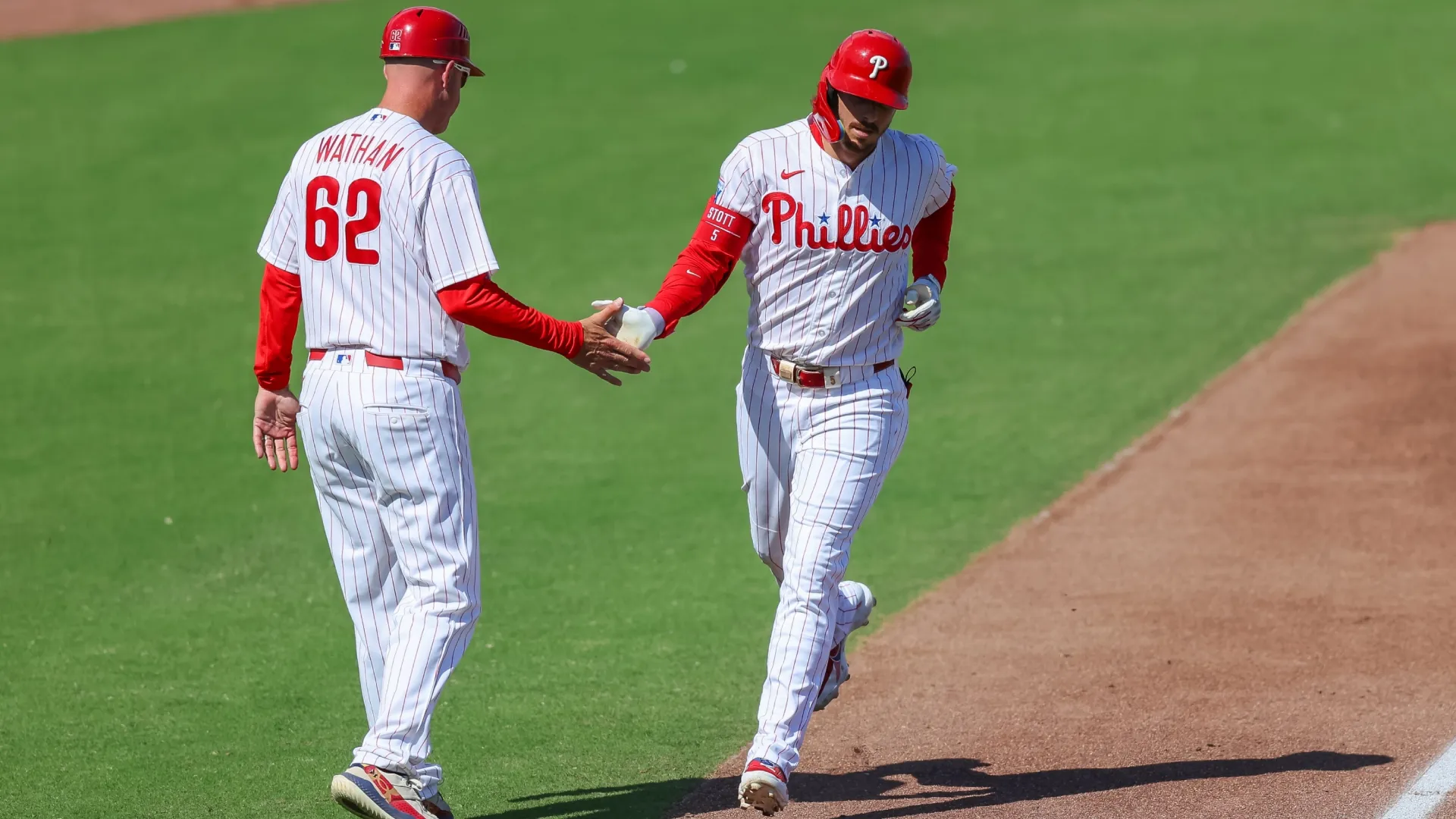 Bryson Stott #5 of the Phillies celebrates his home run against the Yankees. Mike Carlson/Getty Images