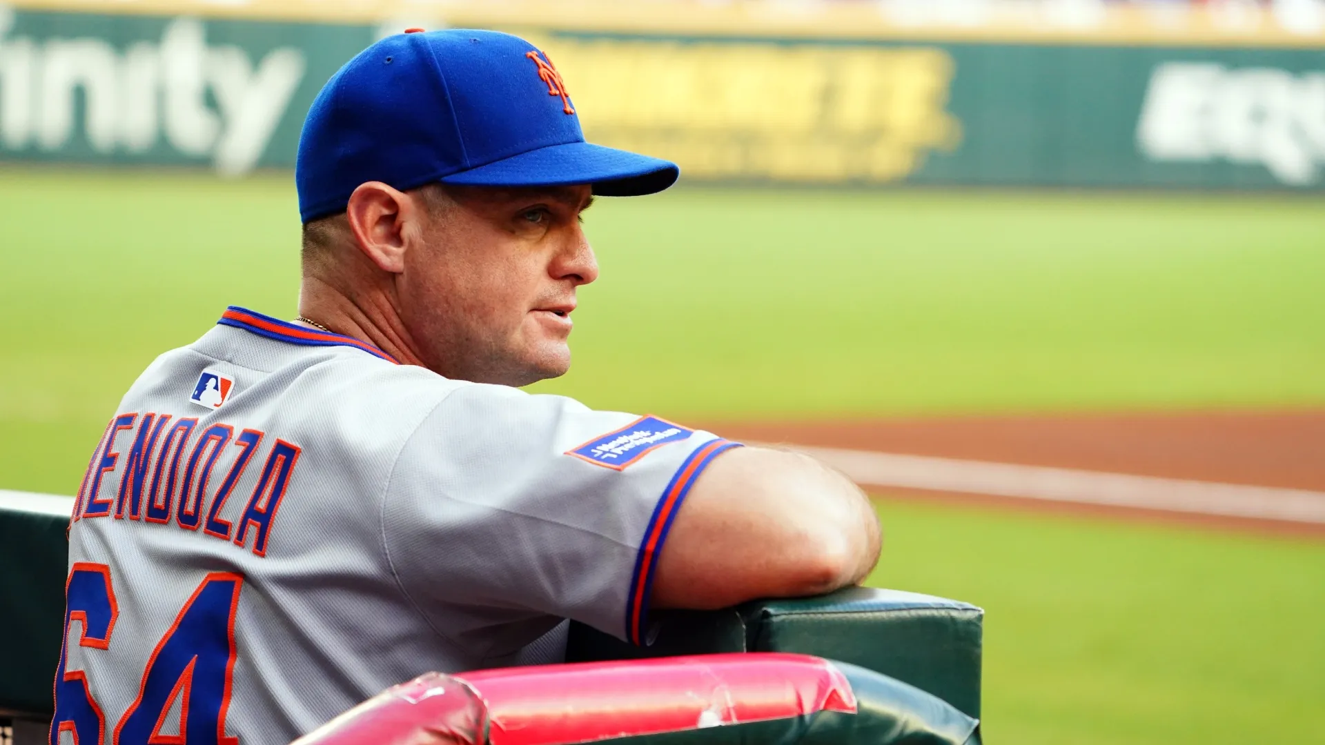 Carlos Mendoza #64 of the Mets looks on from the dugout. John David Mercer/Getty Images