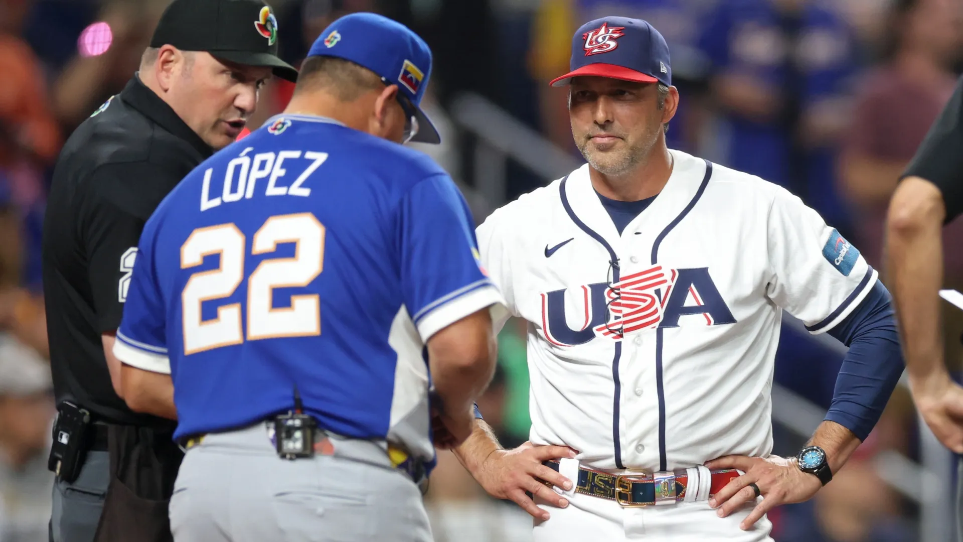 Manager Mark DeRosa #9 of TeamUSA and manager Omar Lopez #22 of Team Venezuela exchange lineups. Al Bello/Getty Images