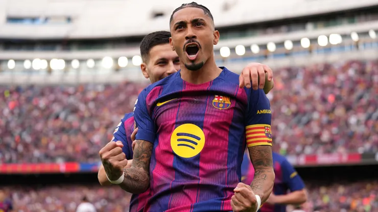 Raphinha of Barcelona celebrates scoring his team's first goal with teammate Roony Bardghj in 2026.