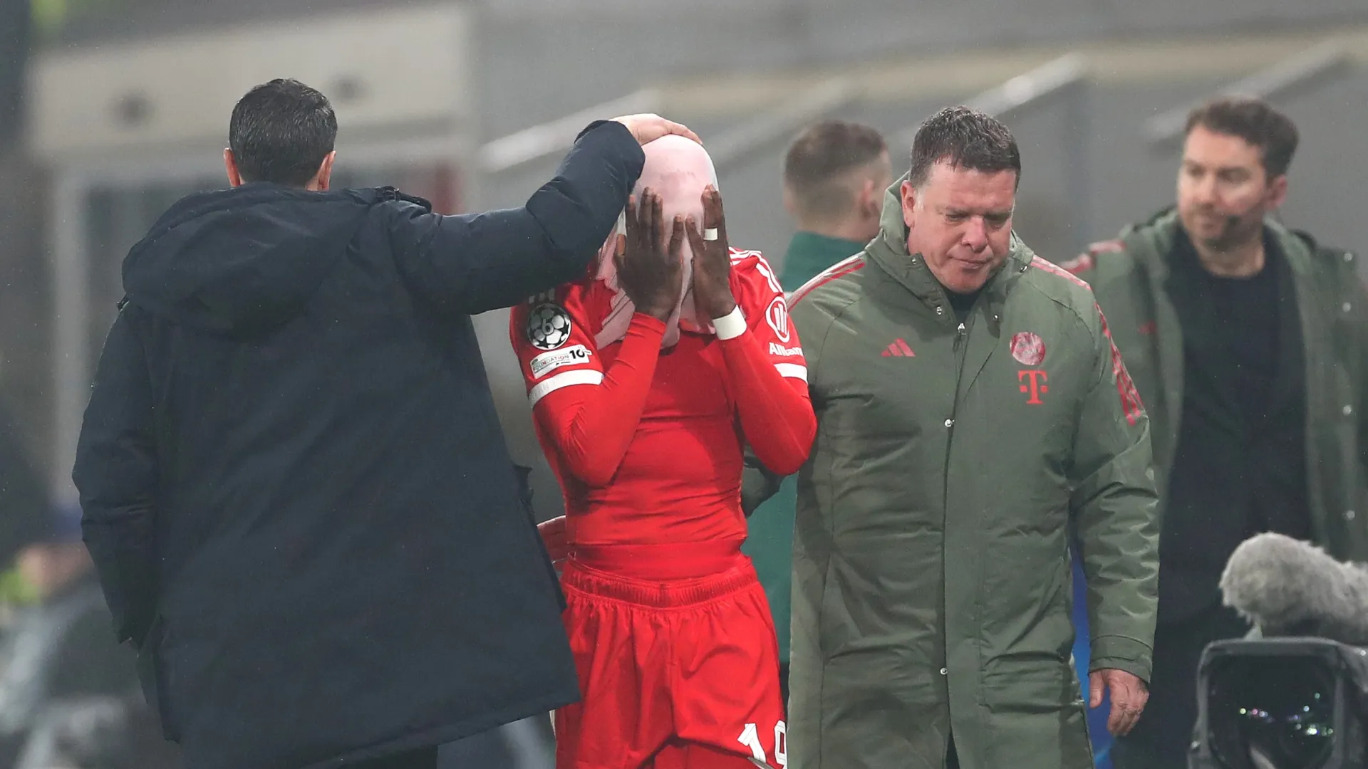 Alphonso Davies reacts after sustaining an injury.