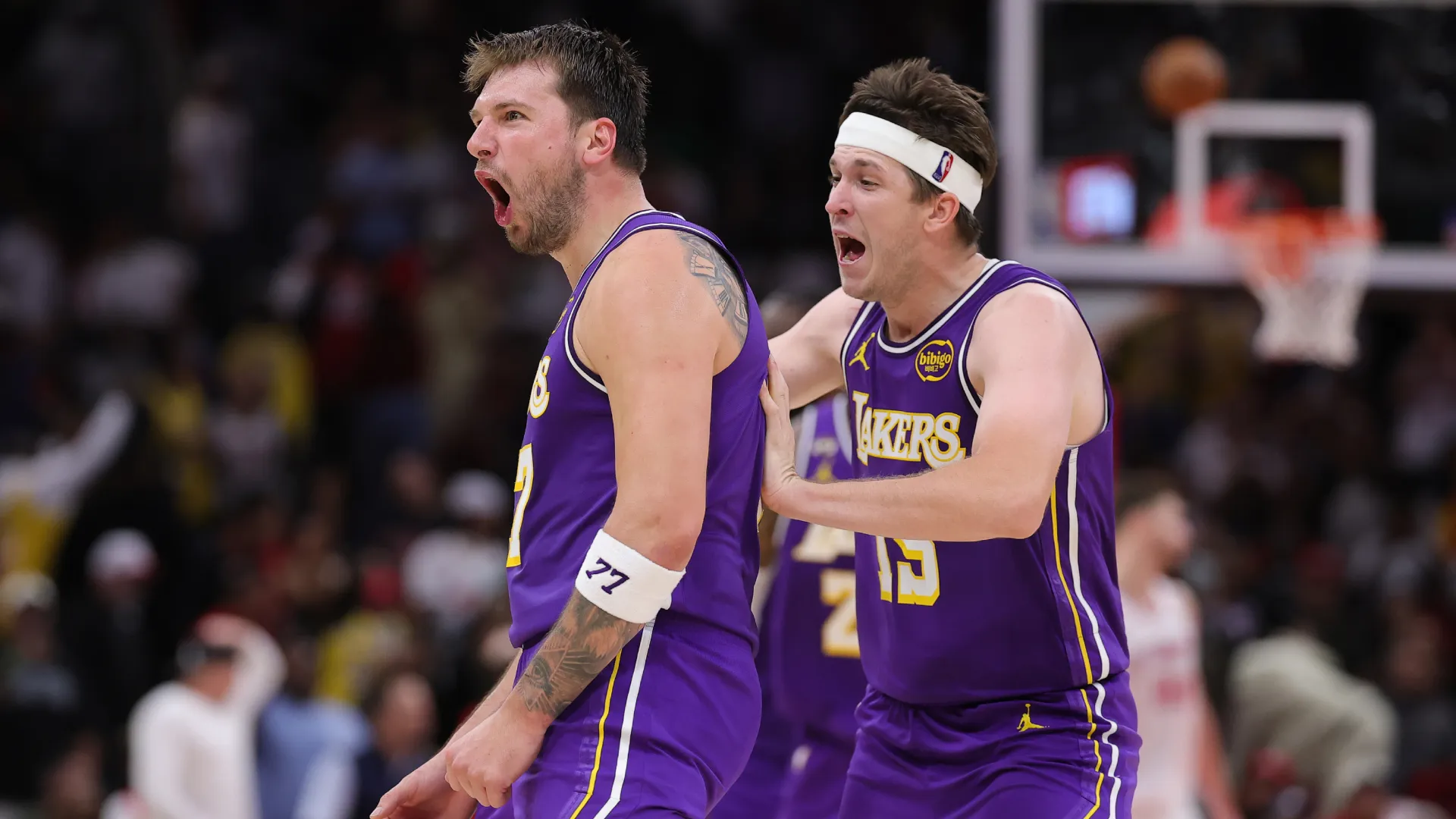 Austin Reaves celebrates with Luka Doncic at Toyota Center. (Getty Images)