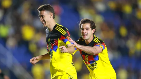 Rodrigo Dourado of America celebrates scoring his team's first goal with teammate Patricio Salas