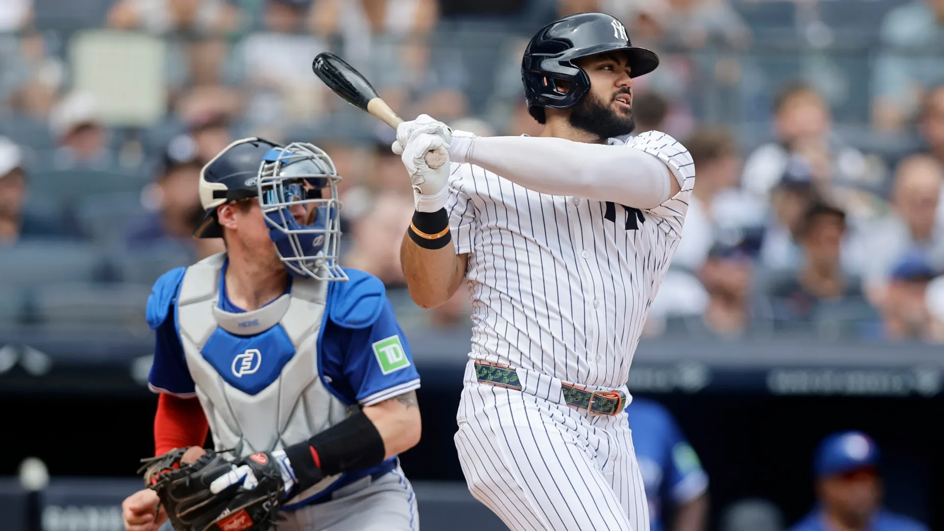 Jasson Dominguez #24 of the Yankees follows through on his second inning RBI base hit.  Jim McIsaac/Getty Images