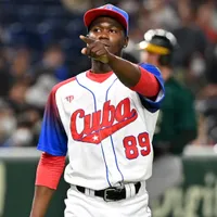 Why the reigning Japanese Pacific League MVP Livan Moinelo hasn’t reported to his team yet?