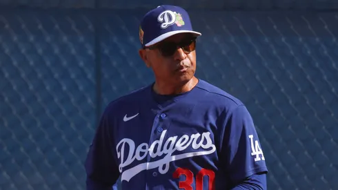 Dave Roberts #30 of the Los Angeles Dodgers looks on.