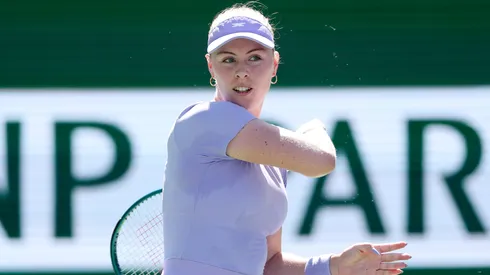 Talia Gibson returns a shot to Jasmine Paolini of Italy during Day 7 of the BNP Paribas Open.
